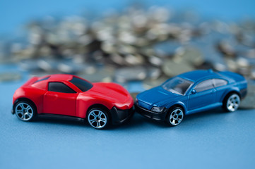 Fototapeta na wymiar toy car crashed into coins
