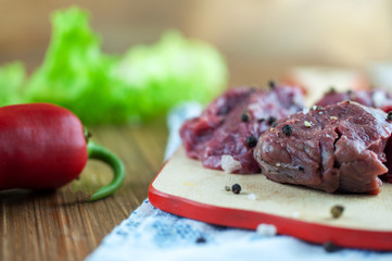 appetizing fresh meat with spices on a cutting Board