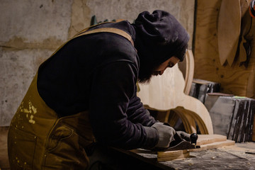 Carpenter working with plane