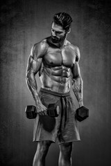 Obraz na płótnie Canvas Handsome Muscular Men, Bodybuilder Lifting Weights. copy space