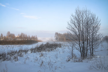 Beautiful winter landscape with a snowy river and lake. Christmas and New Year theme