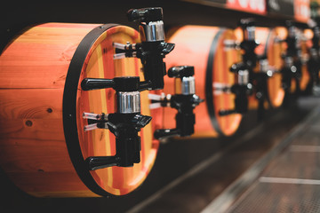 Equipment for draft beer. Draft beer in a store, bar, restaurant. Wooden barrels for draft beer. Trade, product presentation.
