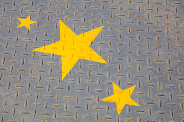 Yellow stars in the checkered plate
