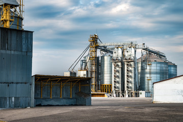 agro-processing and manufacturing plant for processing and silver silos for drying cleaning and storage of agricultural products, flour, cereals and grain. Granary elevator © hiv360