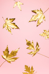 Autumn flat lay with golden leaves creative pattern