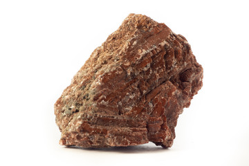 Rock of red gypsum mineral from Spain isolated on pure white background.