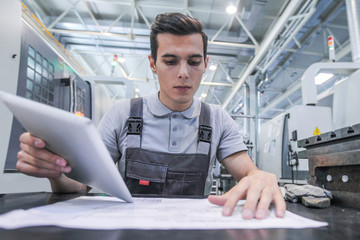 Man working with documents at plant