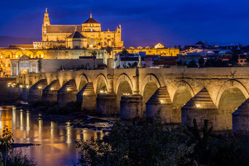 Evening view of the Mosque-Cathedral and Roman Bridge in Cordoba, Spain