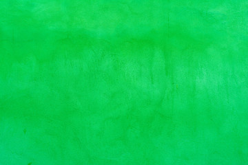 Background of an old concrete wall painted green with fine texture
