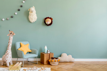 Stylish scandinavian kid room with toys, teddy bear, plush animal toys, mint armchair, umbrella,...