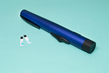 glucose meter and syringe insulin, diabetes concept
