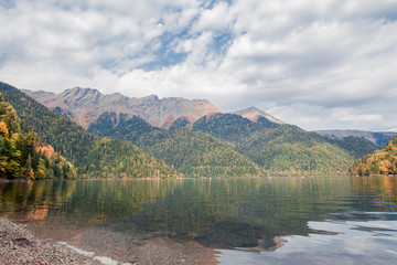 Fototapeta premium Lake Ritsa Abkhazia mountains water nature autumn trees