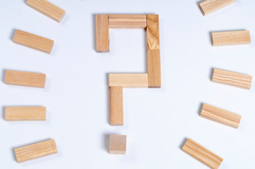 question mark made of wooden blocks on a white background