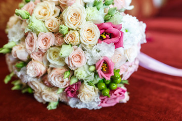 bright wedding bouquet of summer white pink roses  with wedding rings