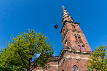 Church of Our Saviour in Copenhagen, 	Denmark. The black and golden spire reaches a height of 90...