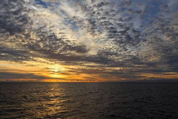 sunrise with clouds on the ocean