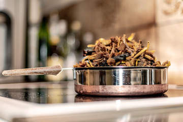 Autumn chantarelles prepared for fridge by removing moist before freezing
