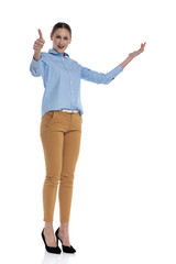young businesswoman holding hands in the air