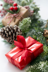 Naklejka na ściany i meble Christmas red gifts presents on isolated background. Festive holiday decorations on white background.