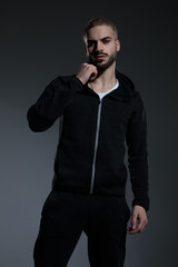 Fototapeta premium young fashion model wearing gym suit and holding hands