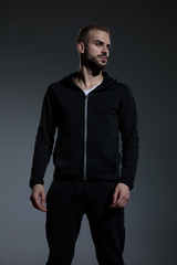 Fototapeta premium fashion man wearing gym suit and looking to side
