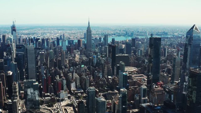 High aerial of Manhattan, drone shooting of New York City, skyscrapers and landmark buildings, famous cityscape