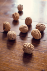 Walnuts in shell on wooden table