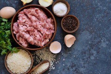 Cooking process of meat balls on the kitchen table. Ingredients for cooking meat. View from above.
