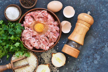 Cooking process of meat balls on the kitchen table. Ingredients for cooking meat. View from above.
