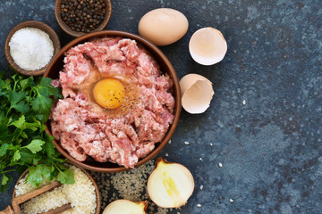 Cooking process of meat balls on the kitchen table. Ingredients for cooking meat. View from above.