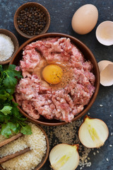 Cooking process of meat balls on the kitchen table. Ingredients for cooking meat. View from above.