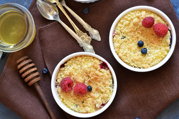 Crumble with berries, honey and almonds. View from above.