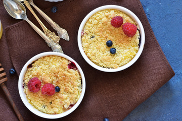 Crumble with berries, honey and almonds. View from above.