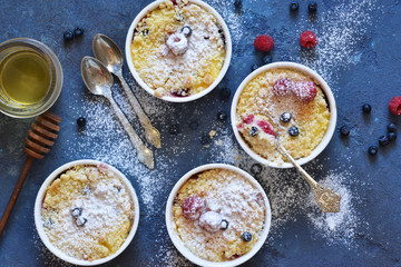 Vanilla cheesecake with berries on the kitchen table.