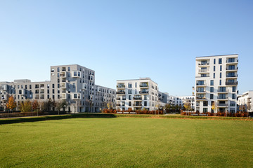 Modern apartment buildings in a green residential area in the city - 295713757