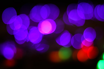 Beautiful Christmas background with garlands and bokeh. New year  multi-colored picture. Abstract photo image for design