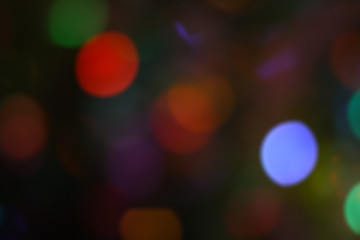 Beautiful Christmas background with garlands and bokeh. New year  multi-colored picture. Abstract photo image for design