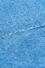 Fototapeta na wymiar Blue rough stone texture closeup vertical background, copy space background