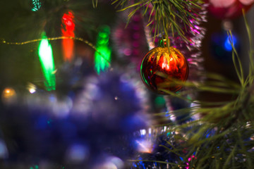 Christmas tree decorated with toys and a garland. New year background for your design. Seasonal holidays in winter