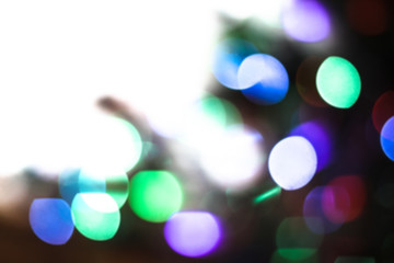 Beautiful Christmas background with garlands and bokeh. New year  multi-colored picture. Abstract photo image for design