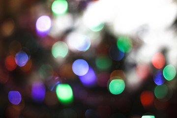 Beautiful Christmas background with garlands and bokeh. New year  multi-colored picture. Abstract photo image for design
