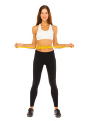 Young healthy girl doing exercises, full length portrait isolated over white background