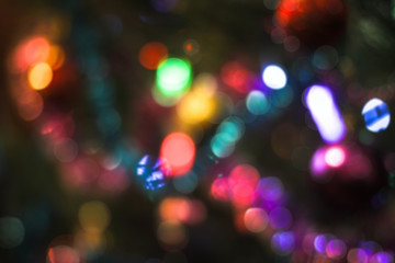 Beautiful Christmas background with garlands and bokeh. New year  multi-colored picture. Abstract photo image for design