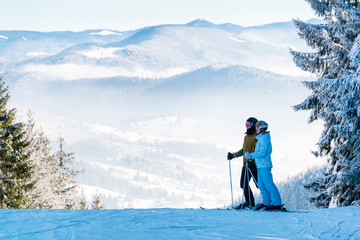 Couple of skiers on a morning ski slope