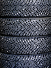 new winter tire set with studs at tire shop