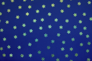 Blue abstract christmas background with holographic glitter snowflake