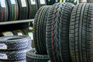 Fototapeta na wymiar new winter tire sets without studs at tire shop