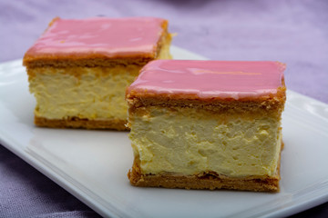 Tompoes or tompouce, iconic pastry in Netherlands and Belgium made from puff dough, icing, cream