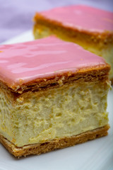 Tompoes or tompouce, iconic pastry in Netherlands and Belgium made from puff dough, icing, cream
