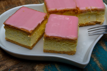 Tompoes or tompouce, iconic pastry in Netherlands and Belgium made from puff dough, icing, cream